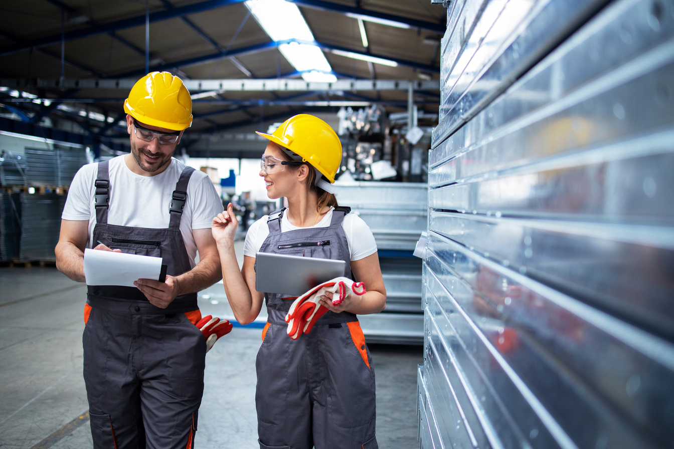 Factory workers analyzing production.