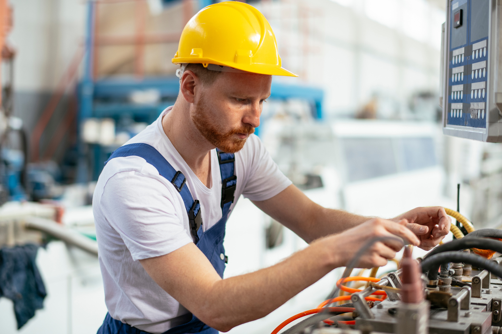 Factory worker controlling production